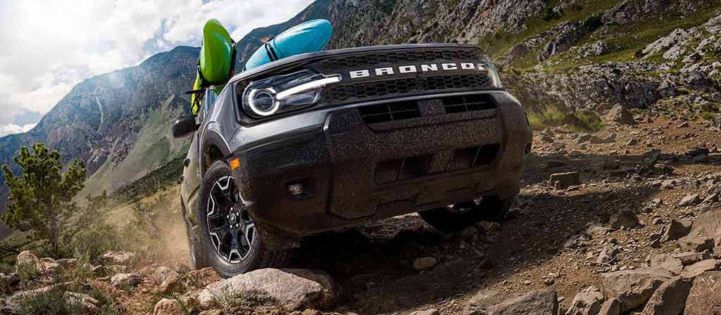 2026 Ford Bronco Sport® being driven up a hill on rocky terrain