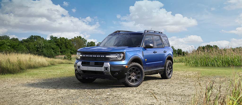 2026 Ford Bronco Sport® parked on a gravel area with trees in the background