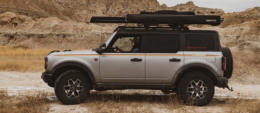 2024 Ford Bronco® Badlands® with roof rack in desert landscape
