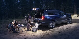 2026 Ford Expedition® MAX Platinum® SUV with available 360-degree Zone Lighting with people nearby