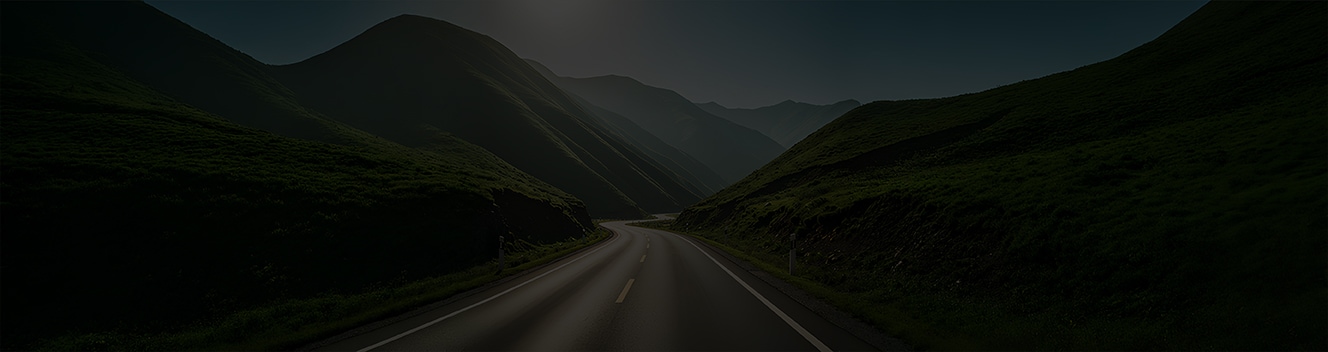 A road with mountains on both sides