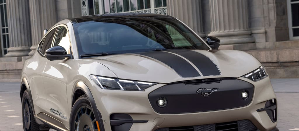2025 Ford Mustang Mach-E® parked in front a building with columns