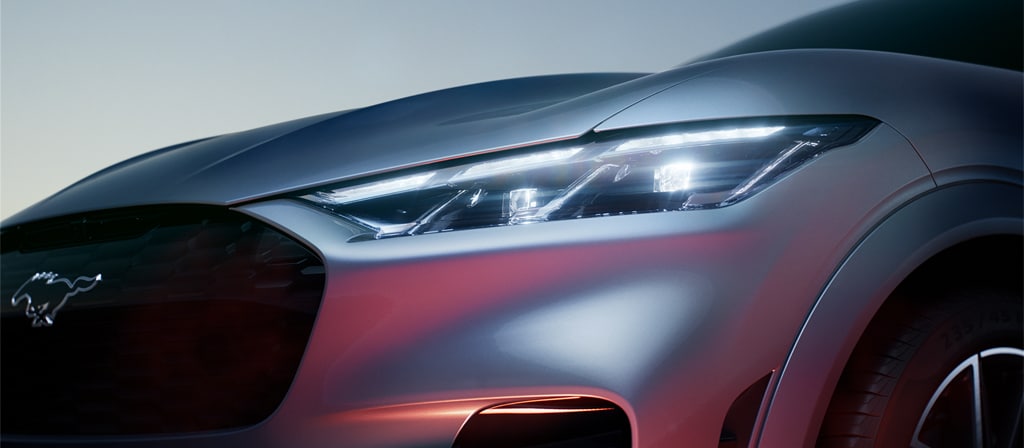 Close-up of the light glinting off the front left quadrant of the 2026 Ford Mustang Mach-E® SUV