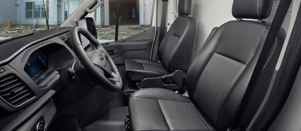 The interior of a 2026 Ford Transit® van driver's and passenger's seat