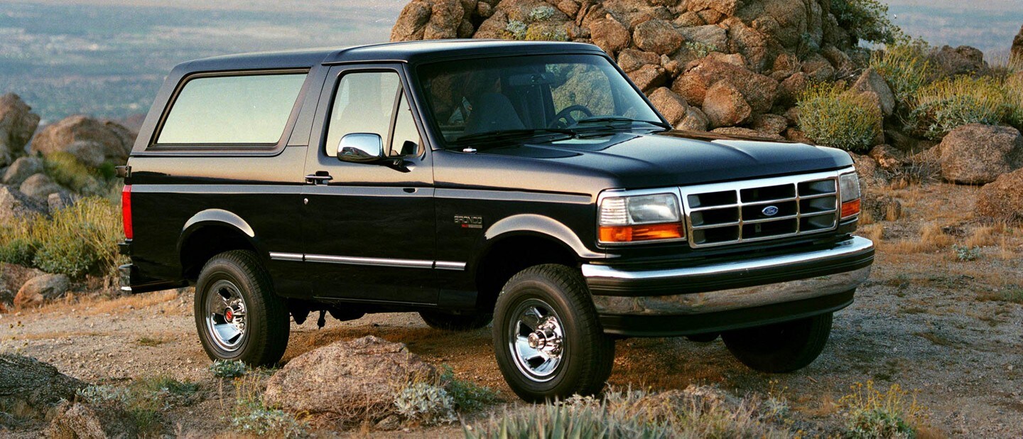 1994 Ford Bronco XLT parked on a mountain trail 