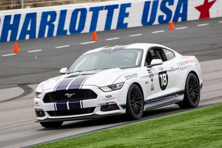 A 2023 Ford Mustang® model being driven on a track