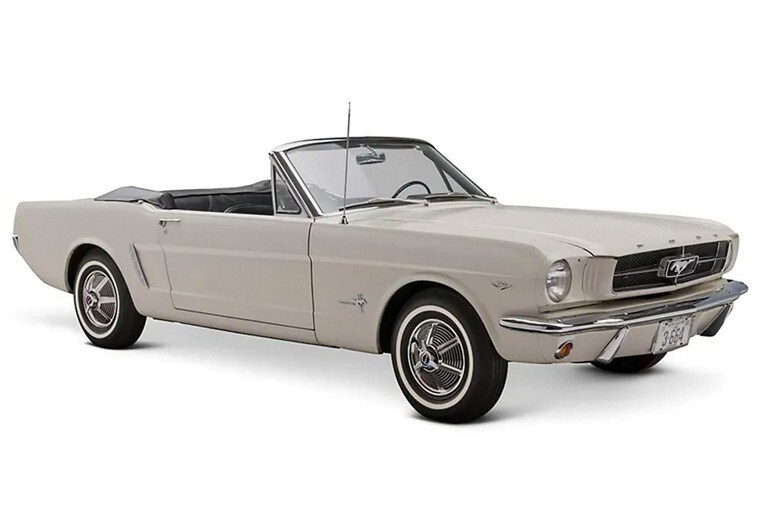 A 1965 Ford Mustang® convertible model in white on a white background