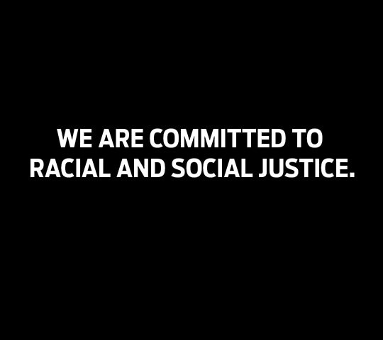 A black background with the words we are committed to racial and social justice