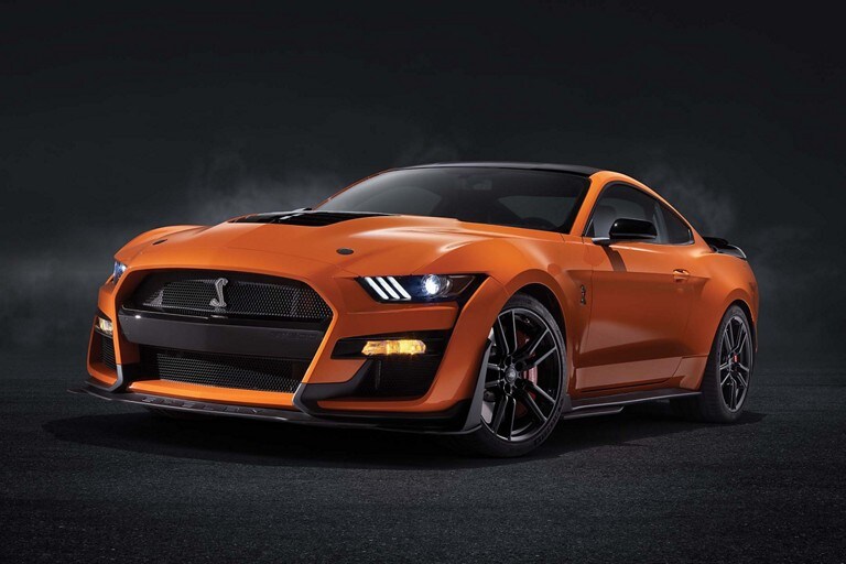 A 2021 Ford mustang Shelby GT500 on a black background in Twister Orange