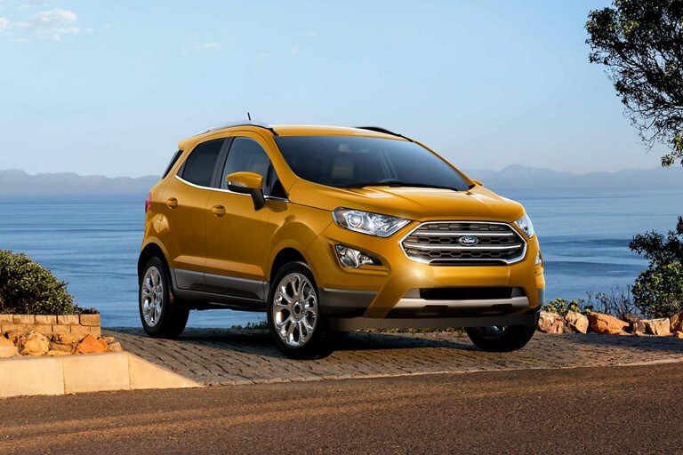 2022 EcoSport® SUV in Luxe Yellow parked near a lake