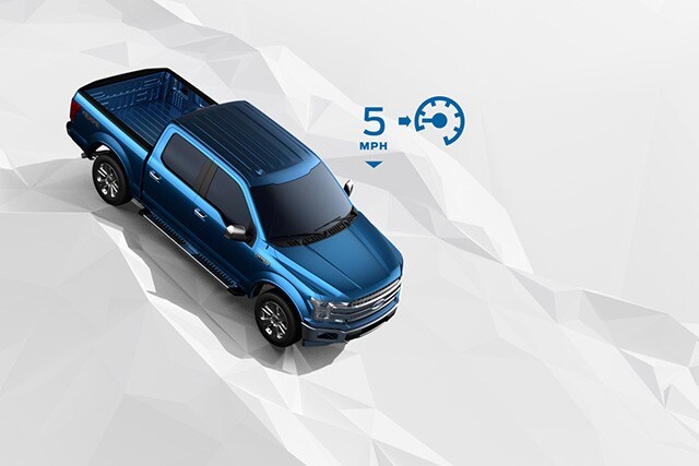 Hill Descent: Animated image of F 150 using Hill Descent Control on bumpy road with 5 miles per hour speed icon