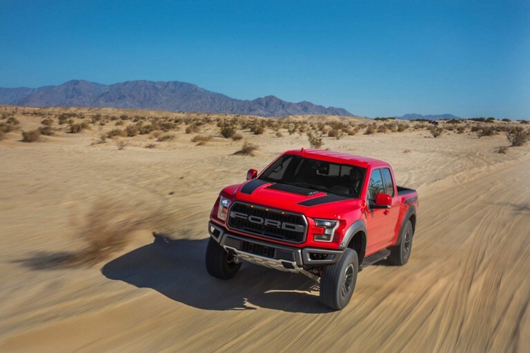 2019 Ford F 150 Raptor Truck Model Highlights Raptor Driving Fast On Sand Road