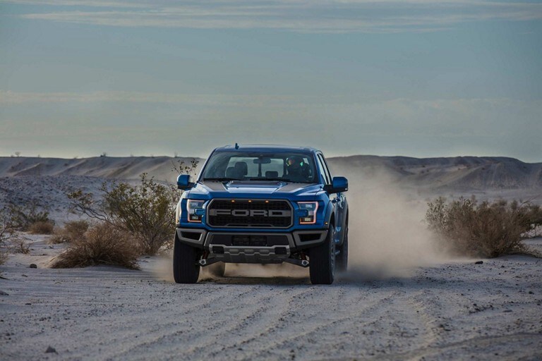 2019 Ford F 150 Raptor Truck Model Highlights Velocity Blue Raptor Driving Fast On Sand Road