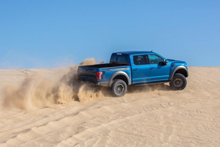 2019 Ford F 150 Raptor Truck Model Highlights Velocity Blue Raptor Driving Fast On Sand Hill