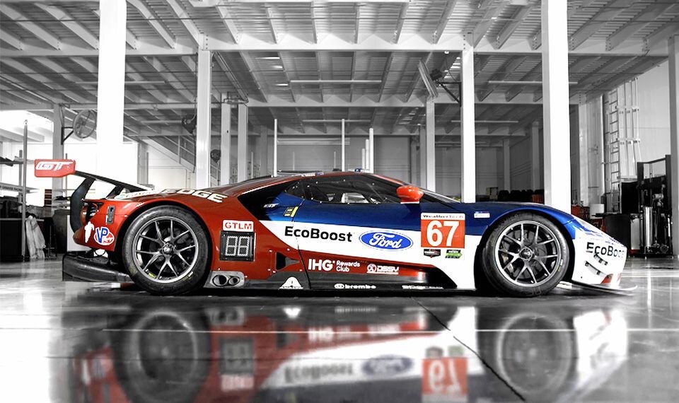 Ford G T race car in a garage as shown in video