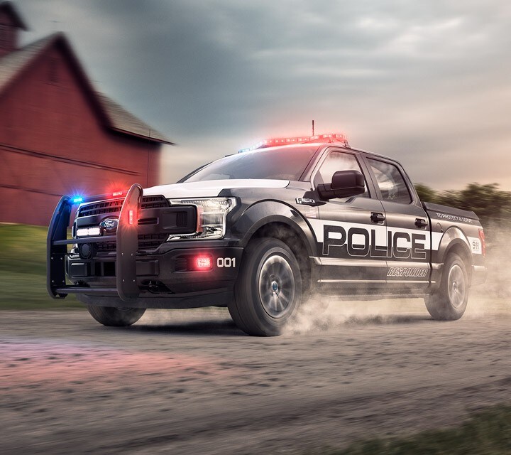 Ford Police Vehicles Tested Street Proven The F One Fifty Police Responder Drives Along A Country Road
