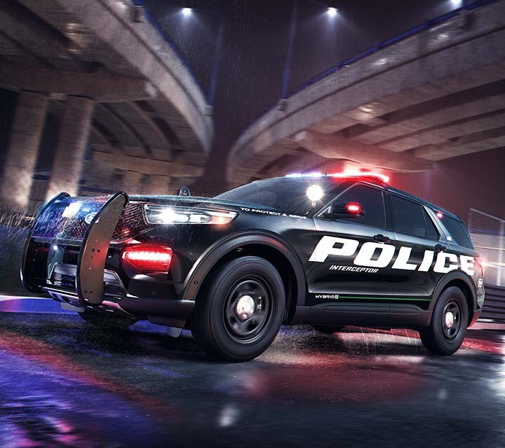 The 2021 Ford Police Interceptor® Utility passing under a city bridge