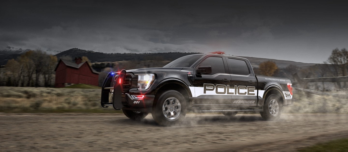 The Ford f 1 50 police responder on a country road
