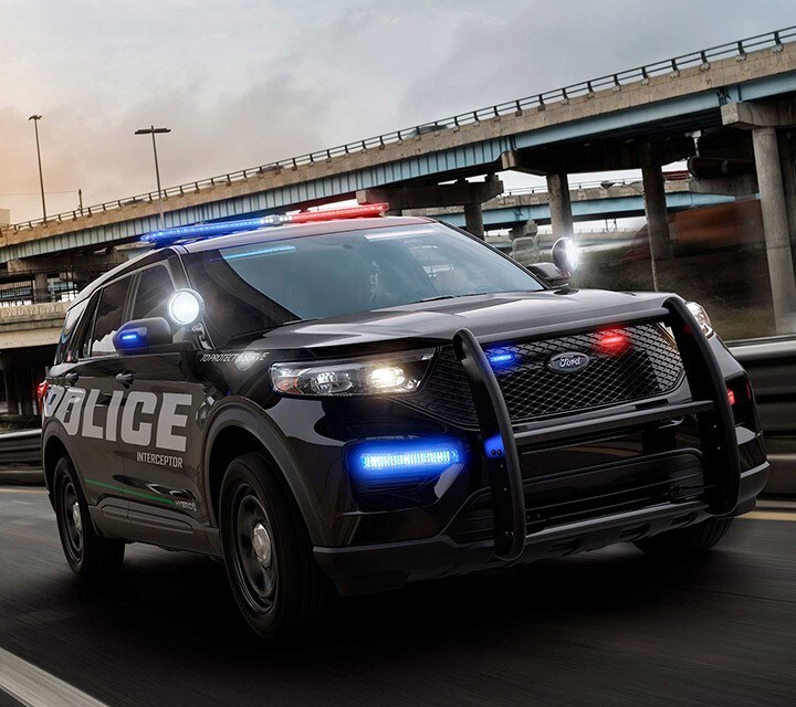 Ford police interceptor utility drives on the highway