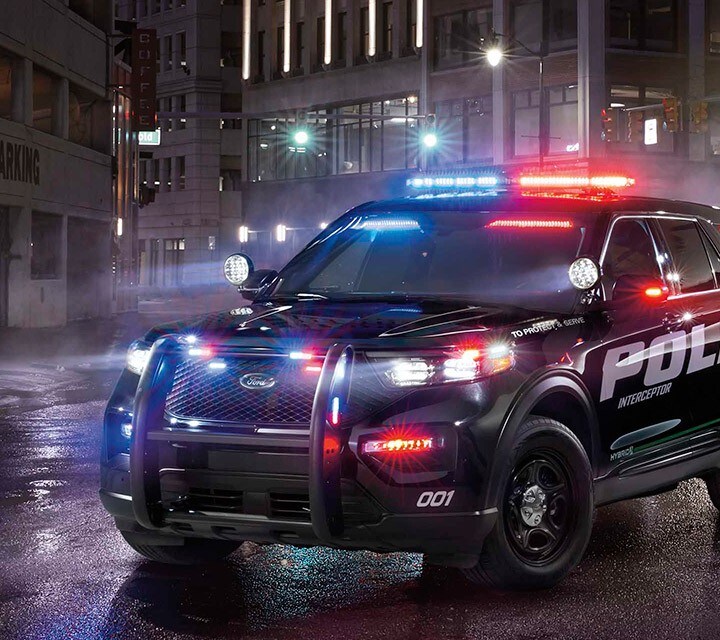 The ford police interceptor utility parked on a darkened city street