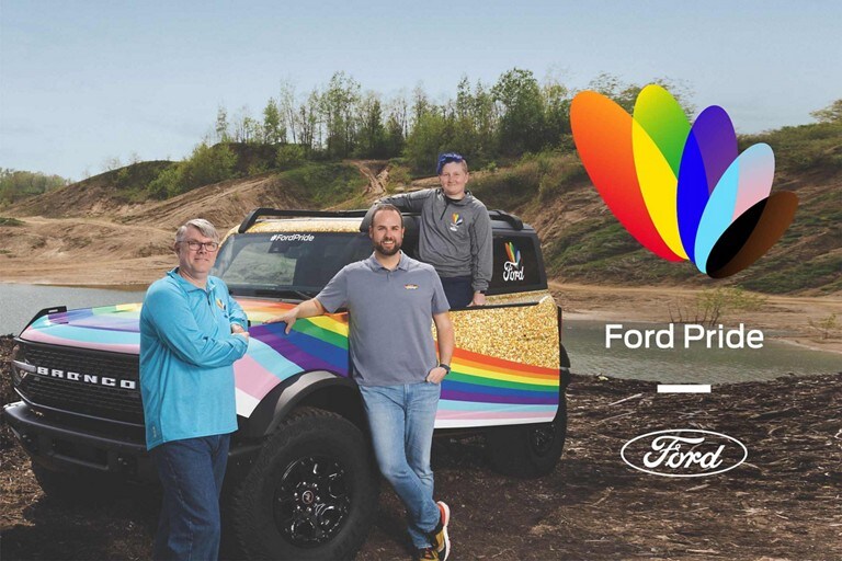 Three men standing around a 2023 Ford Bronco®