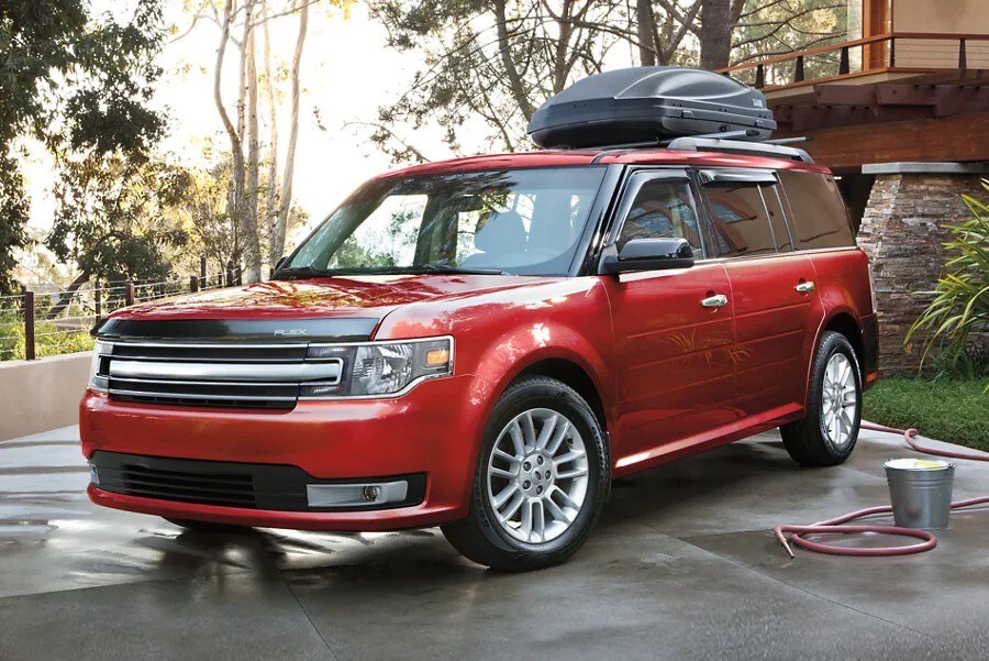 A 2019 Ford Flex parked on a wet driveway after a car wash