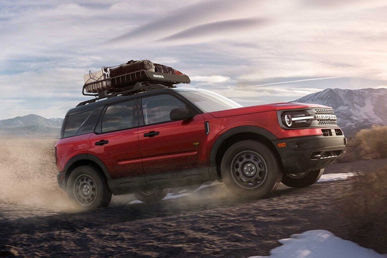 A 2021 Ford Bronco being driven over a rocky terrain