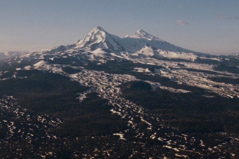 Hill top with mountains and uneven terrain