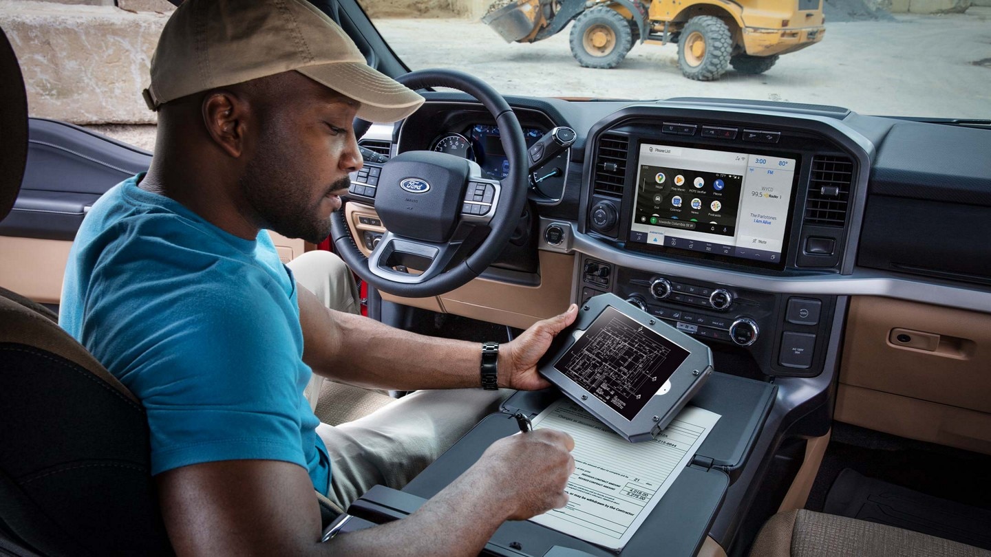 Person using available wireless connectivity on a mobile device at a jobsite