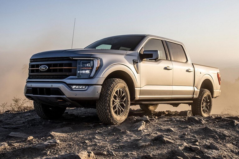 A 2021 Ford F One Fifty Tremor parked on a rocky hill