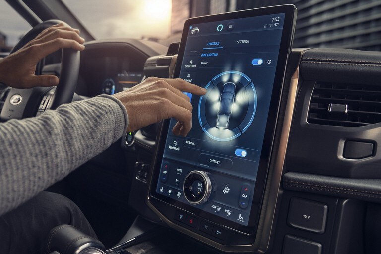 Close-up of a driver interacting with the touchscreen of a 2022 F-150 Lightning.