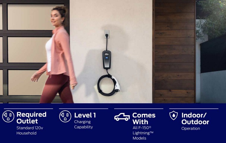 A woman walks away from a plugged in Mobile Power Cord