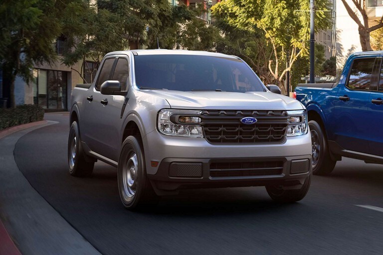 2023 Ford Maverick® driving down a city street