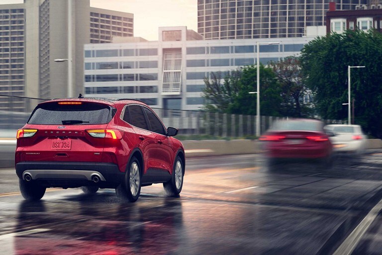A 2020 Ford Escape being driven towards a city
