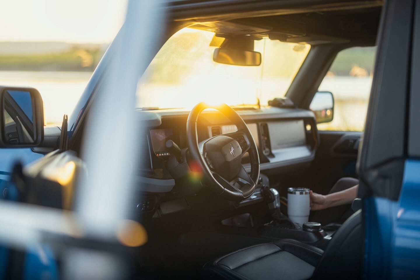 Interior of a 2023 Ford Bronco® SUV through open driver-side door