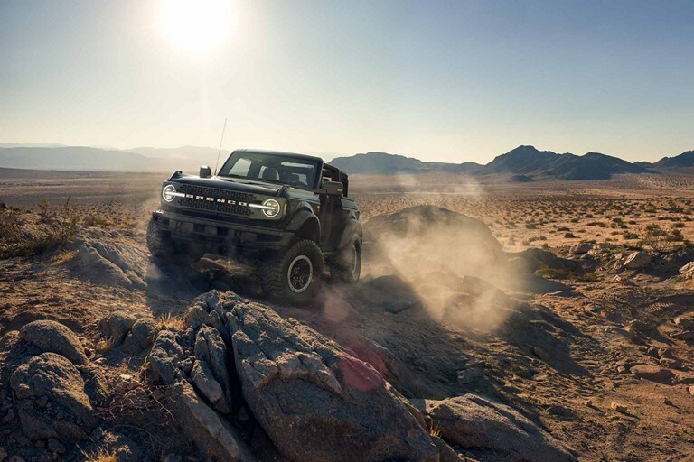 2024 Ford Bronco® being driven over rocky desert terrain