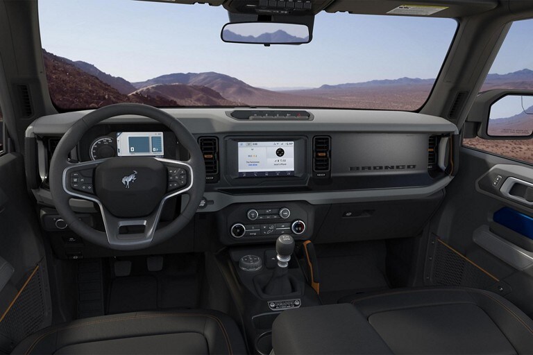 2024 Ford Bronco® interior with available leather-wrapped steering wheel with Bronco® badge, cruise and audio controls