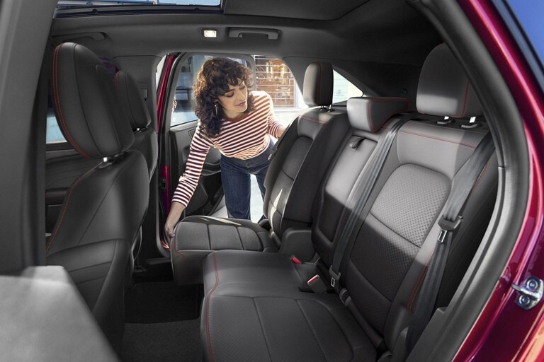 A woman seen pulling down one side of the rear 60/40 seats