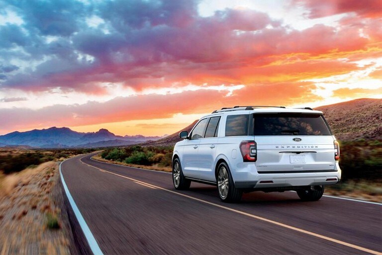 2024 Ford Excursion Limited with the available Excursion Package on a highway heading into a curve