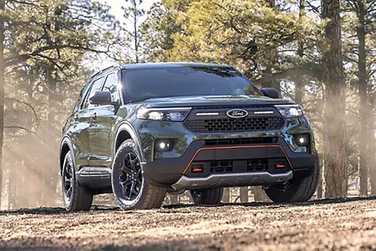 2023 Ford Explorer® Timberline® SUV in Forged Green Metallic parked in the woods