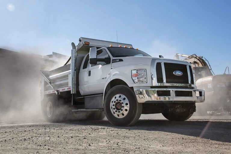2024 Ford F-750 Diesel Super Cab in Oxford White with aftermarket dump equipment at a construction site