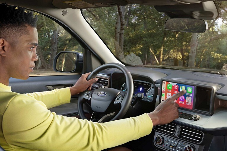 Man using eight-inch touchscreen of 2023 Ford Maverick® truck