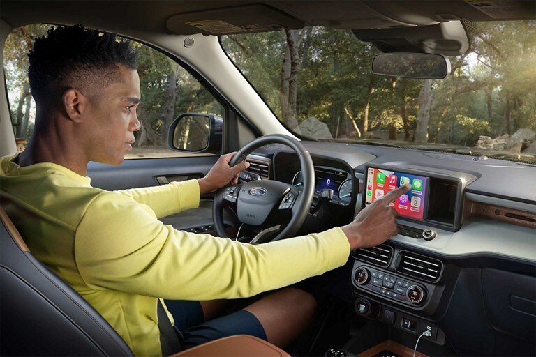 A person using the 8-inch touchscreen of 2024 Ford Maverick® LARIAT® truck