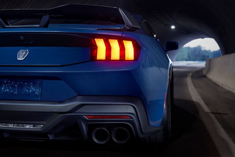 Rear view of a 2024 Ford Mustang® Dark Horse™ model being driven in a tunnel