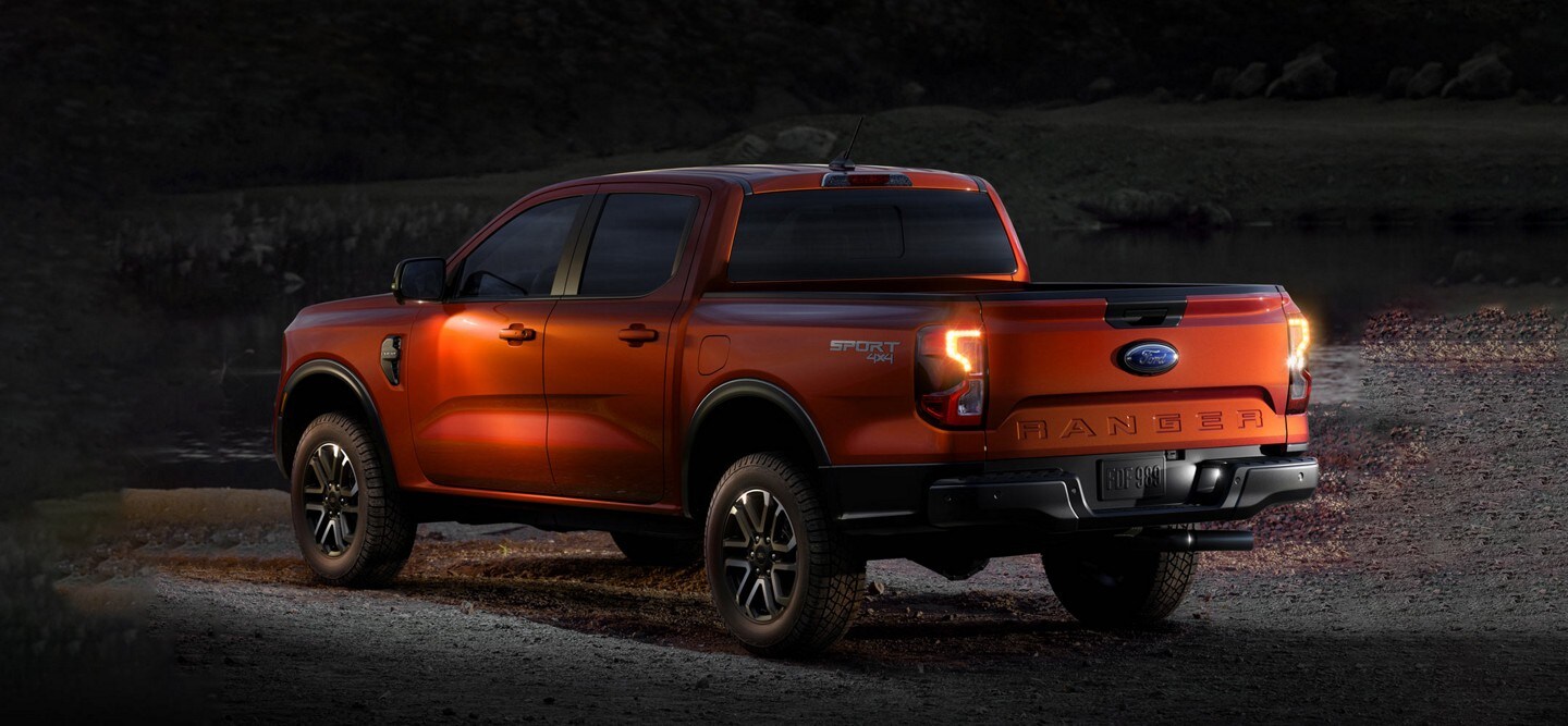 A 2024 Ford Ranger® Raptor® parked at dusk in a scenic location