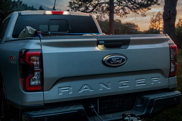 The rear exterior of a 2024 Ford Ranger® at dusk lit up at dusk