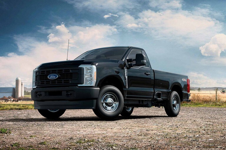 2024 Super Duty® XL in Agate Black with the Off-Road Package parked at a grain factory