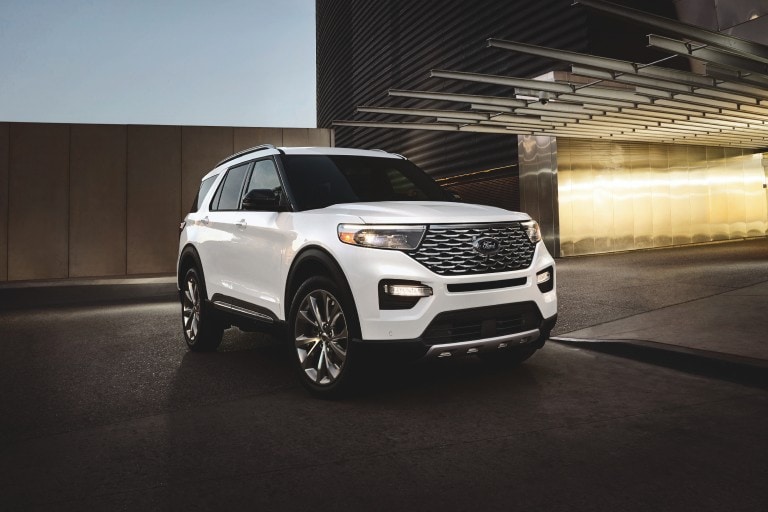 White Ford Explorer parked in a garage