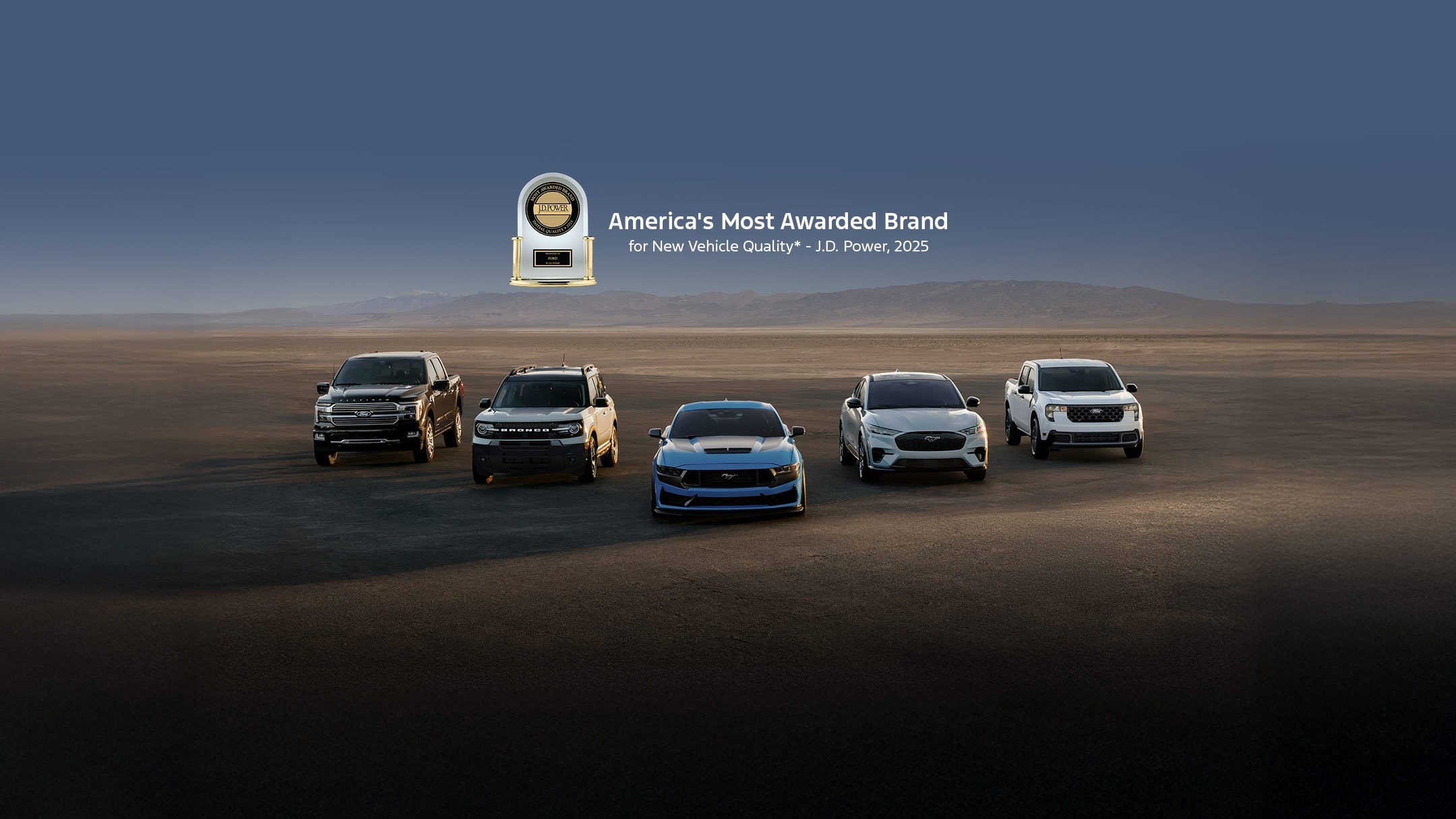 Five Ford vehicles parked in the desert