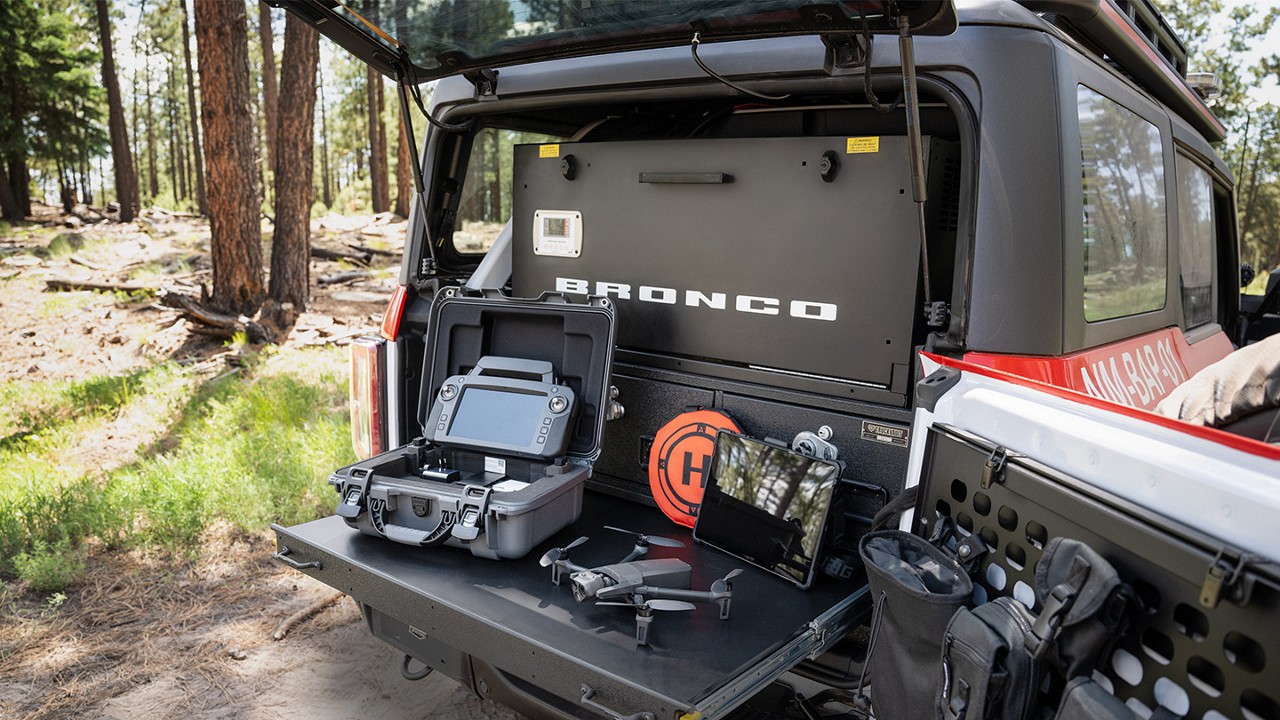 Bronco® Badlands® model with the Sasquatch® Off-Road Package shown with back hatch open and equipment displayed